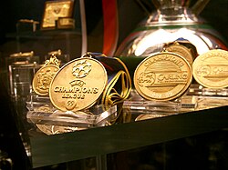 Front three: Manchester United's treble medals of the 1998–99 season are displayed at the club's museum.