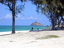 View across Kailua Beach to the offshore islet known as Moku nui, one of the Nā Mokulua islands off Lanikai