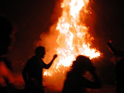 Running around the New Year bonfire in Mid-City New Orleans (2006)