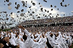 Newly commissioned U.S. Navy and Marine Corps officers celebrate their new positions by throwing their midshipmen covers into the air as part of the U.S. Naval Academy class of 2005 graduation and commissioning ceremony.
