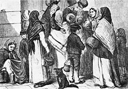 An early morning outside the Opera Tavern in Stockholm, with beggars waiting for scraps from the previous day. Sweden, 1868.
