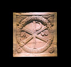 Monogramme of Christ (the Chi Rho) on a plaque of a marble sarcophagus, 4th century CE (Musei Vaticani, here in a temporary exhibition at the Colosseum in Rome, Italy)