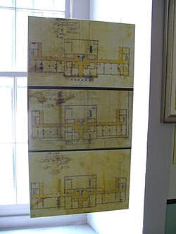 This photo from the Louisiana State Museum in the old U.S. Mint shows the original 1835 plans for the building by William Strickland. The Mint building retains this basic W-shaped design today.