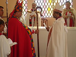 Bishop Maurício Andrade, primate of the Anglican Episcopal Church of Brazil, gives a crosier to Bishop Saulo Barros.