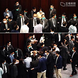 Starry Lee physically occupying the committee chair in LegCo while being protected by security guards and other pro-establishment legislators, on 8 May 2020.