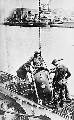 Sea mines are loaded in a UC coastal submarine in the harbour of Zeebrugge