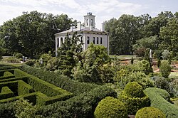 Tower Grove House seen here behind a hedge maze