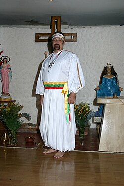 An Umbandista dressed in ritual attire