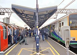 Stratford Station in London is shared by London Underground trains (left) and main line rail services (right), as well as the Docklands Light Railway (not shown).