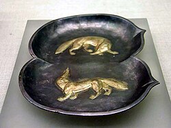 Plate in the shape of two peaches depicting two foxes, Tang dynasty