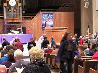 The faithful receive ashes during the celebration of the Mass in an Evangelical-Lutheran parish church.
