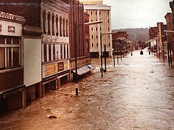 View from Erie Lackawanna train tracks, looking down Water Street during the flood of 1972. The Chemung Canal bank building can be seen in the background.