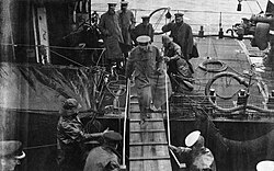 One of the last photographs taken of Kitchener. He is boarding HMS Iron Duke from HMS Oak at Scapa Flow, to confer with Admiral Jellicoe, 5 June 1916