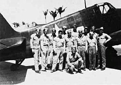 Pilots of VMF(N)-533 pose in front of one of their Grumman F6F-5N Hellcat aircraft on Okinawa, Japan, in 1945.