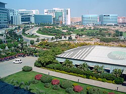 City panorama showing gardens, clean roads and modern office buildings
