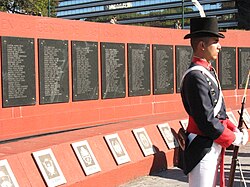 The Monumento a los Caídos en Malvinas ("Monument for the Fallen in the Falklands") in Plaza San Martín, Buenos Aires. A member of the historic Patricios regiment stands guard[nb 6]