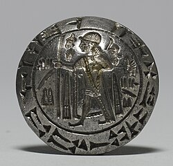 Anatolian hieroglyphs surround a figure in royal dress. The inscription, repeated in cuneiform around the rim, gives the seal owner's name: the ruler Tarkasnawa of Mira. This famous bilingual inscription provided the first clues for deciphering Anatolian hieroglyphs.