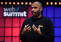 Henry speaking against online bullying at the Web Summit in 2021