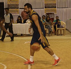 Bhriguvashi dribbling the ball down the court.