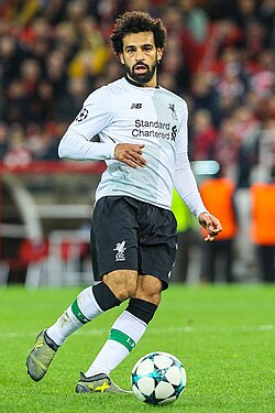 Salah playing for Liverpool in 2017. His performances in the 2017–18 season saw him receive numerous accolades, including PFA Players' Player of the Year and the Football Writers' Player of the Year.