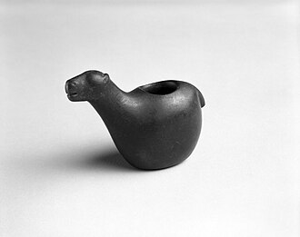 Camelid Conopa, 1470–1532, Brooklyn Museum. Small stone figurines, or conopas, of llamas and alpacas were the most common ritual effigies used in the highlands of modern-day Peru and Bolivia. These devotional objects were often buried in the animals' corrals to bring protection and prosperity to their owners and fertility to the herds. The cylindrical cavities in their backs were filled with offerings to the gods in the form of a mixture including animal fat, coca leaves, maize kernels and seashells.