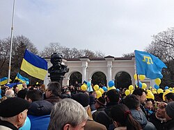Pro-Ukrainian demonstration in Simferopol (Ukrainian flag on the left, Crimean Tatar flag on the right) during the Russian military intervention in Crimea, March 2014