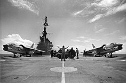 Two Crusaders prepare to launch from USS Midway; their variable-incidence wings are in the "up" position.