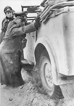 Rommel helping to free his staff car, a Škoda Superb Kfz 21[293]