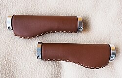 Bicycle grips made of leather. Anatomic shape distributes weight over palm area to prevent cyclist's palsy (ulnar syndrome).[70]