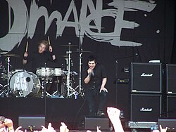 My Chemical Romance, dressed in black, onstage