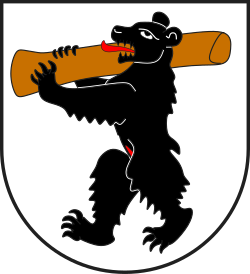 The bear on the arms of Portein, Switzerland, carrying a log, often interpreted as a phallus in accordance with the long-held tradition
