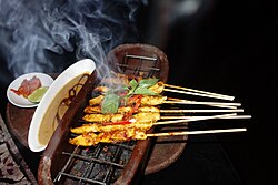 Grilled chicken satay served with peanut sauce in Jakarta