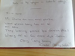 Message written in Sranan Tongo in a guestbook in the Land of Hayracks, an open-air museum in Slovenia (April 2016)