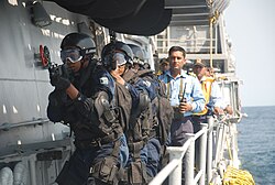 South African marines boarding an Indian warship as part of an exercise