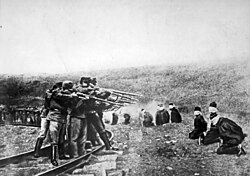 Austro-Hungarian troops executing captured Serbians, 1917. Serbia lost about 850,000 people during the war, a quarter of its pre-war population.[112]
