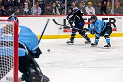 Members of the Buffalo Beauts and the Minnesota Whitecaps during the 2019 Isobel Cup championship game for the NWHL, later known as the Premier Hockey Federation.