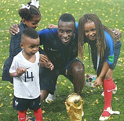 Matuidi and his children posing with the FIFA World Cup Trophy, 2018