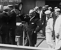 Wilson returning from the Versailles Peace Conference on USS George Washington, as she steamed up New York Harbor on July 8, 1919; the Weimar National Assembly in Germany formally ratified the treaty the following day in a vote of 209 to 116.[252]