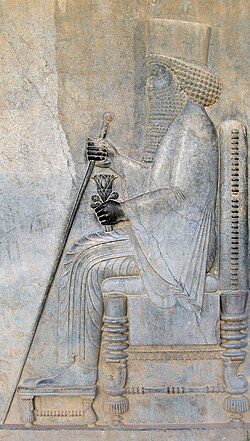 Darius the great holds a water lily In Persepolis