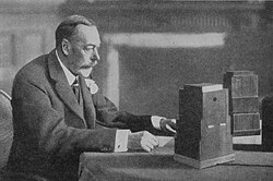 King George V giving the 1934 Royal Christmas message on BBC Radio. The annual message typically reflects on the year's major events.