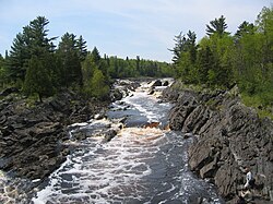 Tilted beds of the Middle Precambrian Thomson Formation in Jay Cooke State Park[58]