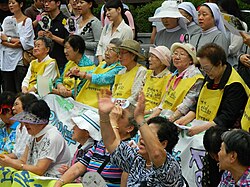 Surviving comfort women (in middle row) at a 'Wednesday demonstration' in front of Japanese Embassy in Seoul