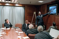 Reagan being briefed by the National Security Council Staff on the 1986 Libya air strike in the White House Situation Room. Seated with Reagan is George Shultz, William Casey, Don Regan, and Charles Gabriel.