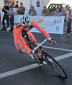 A cyclist leaning in a turn