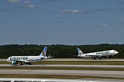 Two Frontier Airlines aircraft, one Airbus A320neo (N330FR) and one A321-200 (N717FR) at Raleigh–Durham International Airport (pictured in 2024)