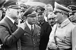 (from left) Hitler; Robert Ley, head of the German Labour Front; Ferdinand Porsche, armaments manufacturer; and Hermann Göring, head of the Four Year Plan (1942)