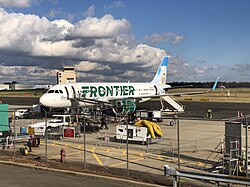 A Frontier Airlines Airbus A320 at the terminal