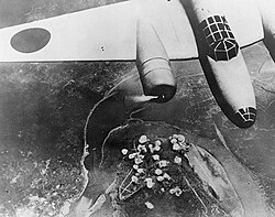 A photograph taken by IJA reporters on 16 June 1940 and published in the Asahi Shimbun showing bombs from IJAAF Type 97/Ki-21 (九七式重爆撃機) heavy bombers exploding on Yuzhong Peninsula