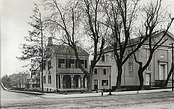 The original church building with Dr. Bartine's house on the corner