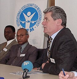 Gauck attending a press conference of the International Society for Human Rights, where he lectured about the Stasi campaign to discredit the Society